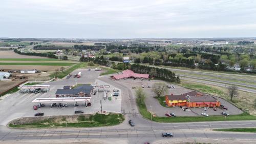 an aerial view of a parking lot with a building at Bloomer Inn & Suites in Bloomer