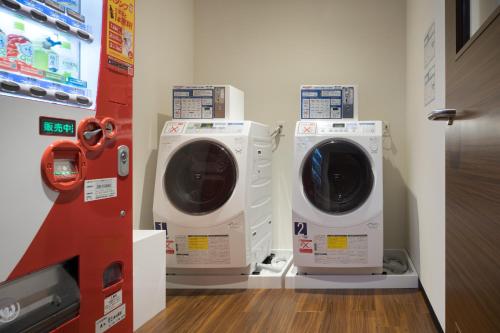 two washing machines are on display in a store at Nest Hotel Hakata Station in Fukuoka