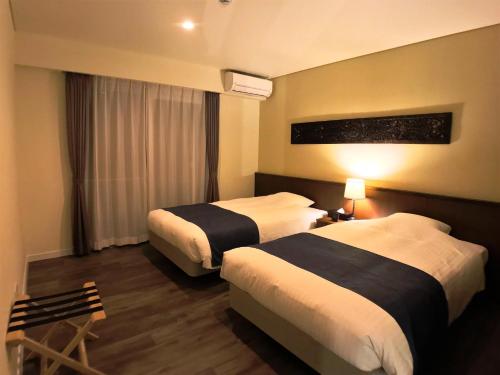 Säng eller sängar i ett rum på Coldio Pool & Villas Sumuide