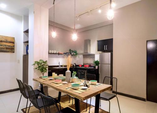 a dining room with a table and chairs in a kitchen at AYA Homestay in Ho Chi Minh City