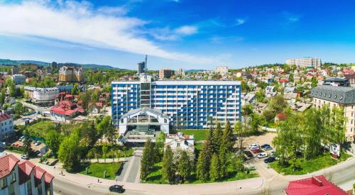 an aerial view of a city with a building at Truskavets 365 Hotel in Truskavets