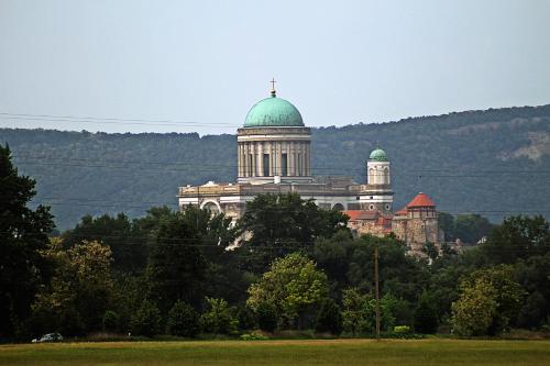 a large building with a cross on top of it at Strigonia Apartman in Esztergom