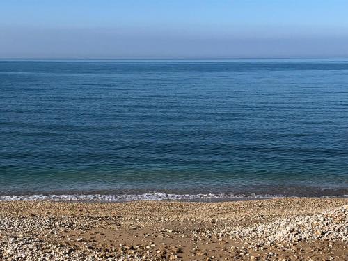 a rocky beach with the ocean in the background at Villa Sciacca Lumia LUNA in Sciacca