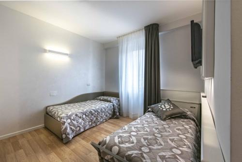 Una cama o camas en una habitación de Hotel Vivit ***S