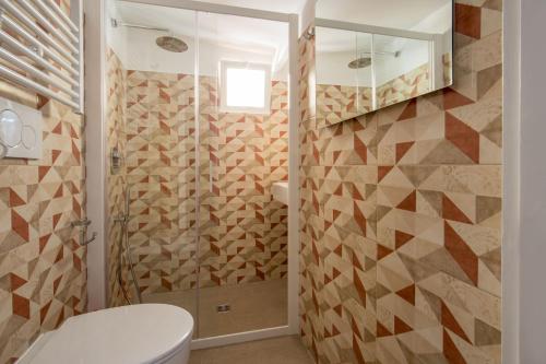 a bathroom with a toilet and a shower at MyTALE Apartment Luxury Navona in Rome