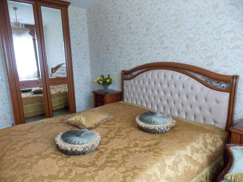a bedroom with a bed with two pillows on it at Weena House in Rotterdam