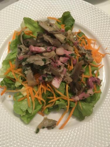 a white plate with a salad with meat and carrots at Caloupilé in Le Tampon
