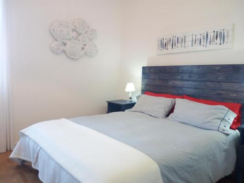 Postel nebo postele na pokoji v ubytování Ambrosio home