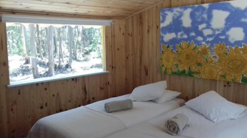 Ένα ή περισσότερα κρεβάτια σε δωμάτιο στο Quintal Alentejano