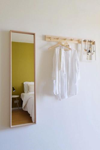 a mirror in a bedroom next to a bed at Villa Scorpio in Rijs