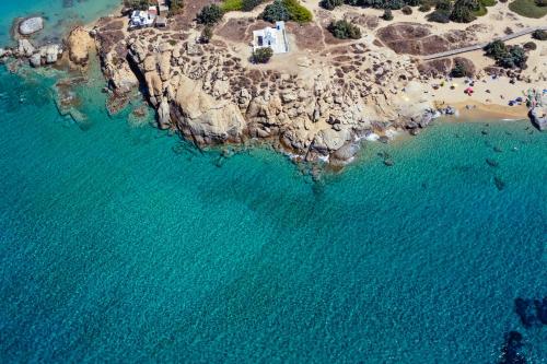 an aerial view of a rocky island in the ocean at Naxos Luxury Villas in Mikri Vigla