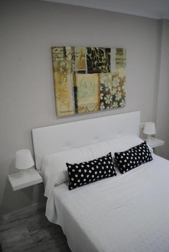 Postel nebo postele na pokoji v ubytování Apartamentos Laguna Beach