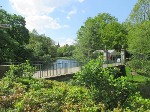 a bridge over a body of water with trees at Bremen City in Bremen