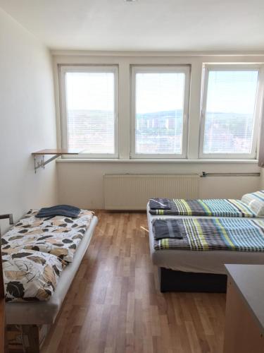 A bed or beds in a room at Šariš rooms