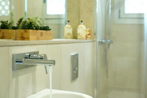 a bathroom with a sink and a shower at Casa Hugo in Pollença