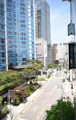 an empty street in a city with tall buildings at Namsan Forest in Myeongdong in Seoul