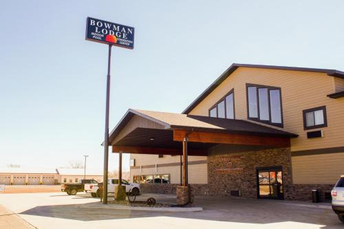 a building with a sign in front of it at Bowman Lodge & Convention Center in Bowman
