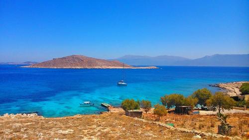a boat in a large body of water at Cohili Villa in Halki
