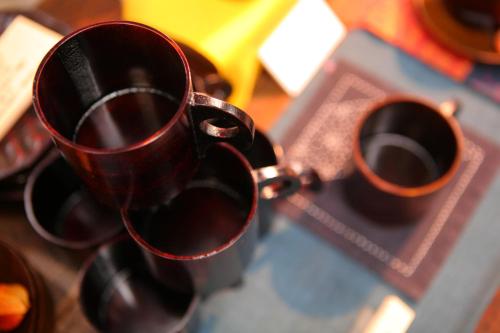 a pair of coffee cups sitting on a table at Onyado Tsutaya in Kiso