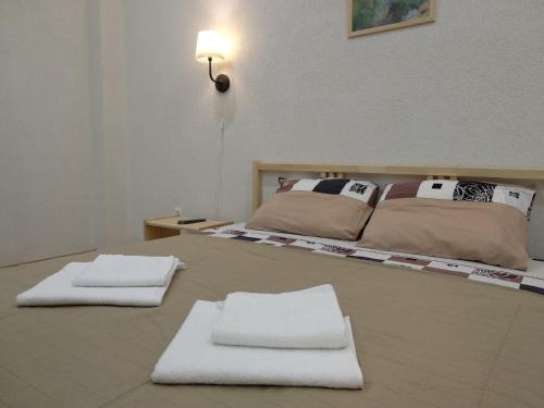 Postel nebo postele na pokoji v ubytování Apartments na Beregu