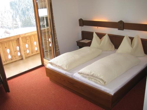 Postel nebo postele na pokoji v ubytování Apartments Spiegl Holzmann