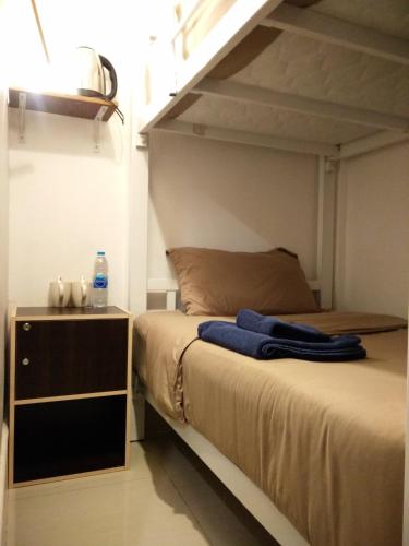 a bedroom with a bunk bed with a ladder at La Locanda in Bangkok