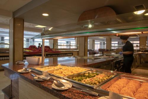 a buffet line with many different types of food at Seramar Hotel Luna Park Adults Only in El Arenal