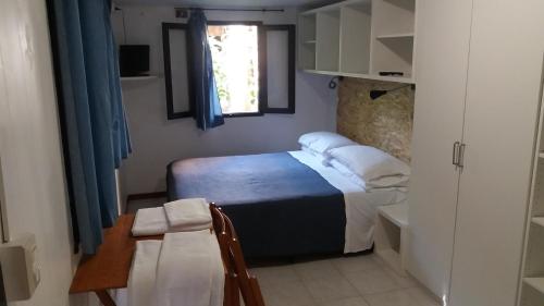 Postel nebo postele na pokoji v ubytování Capricornio Club