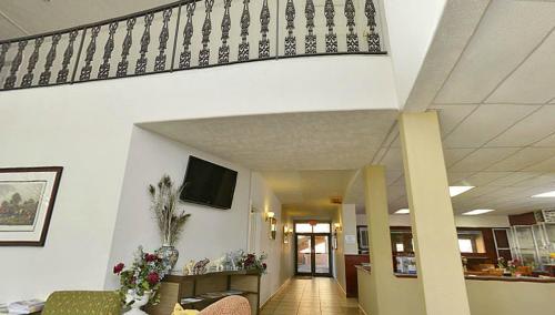 a hallway with a staircase in a hospital at America's Best Value Inn-Marion in Marion