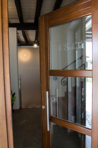 an open glass door to a hallway in a building at Al Sa di Te in Udine