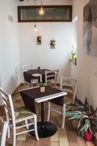 a dining room with a table and chairs at Al Sa di Te in Udine