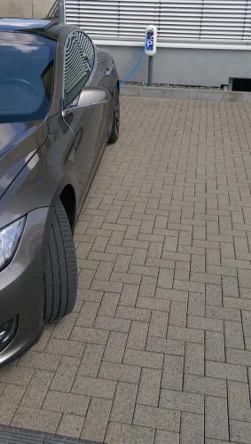 a gray car parked in a parking lot at Hotel im Kornspeicher in Marburg an der Lahn