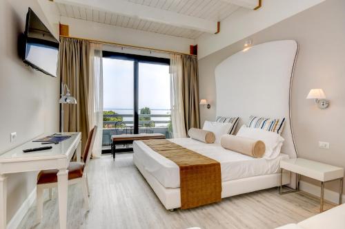 Postel nebo postele na pokoji v ubytování Hotel Oliveto