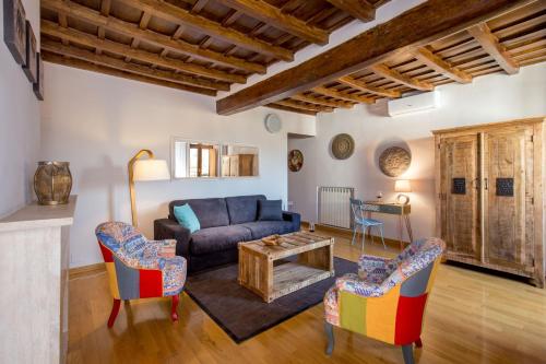 a living room with a couch and chairs at MyTALE Apartment Luxury Navona in Rome