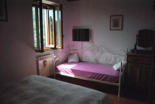 Tempat tidur dalam kamar di Ca Minia