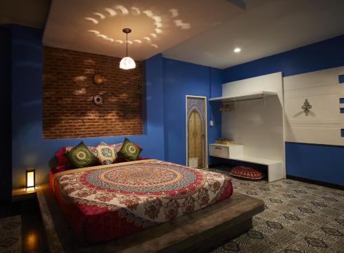 Postel nebo postele na pokoji v ubytování The Sun resort Ratchaburi