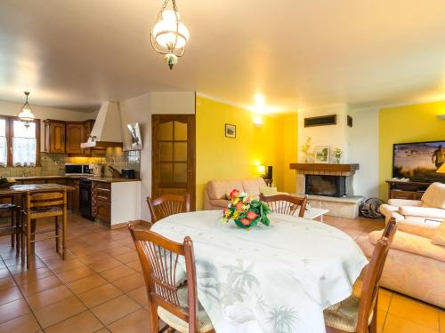 a living room with a table and a kitchen at Colourful Holiday Home in Noves with Swimming Pool in Noves