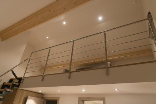 a glass shelf on the ceiling of a room at B&B De Windheer in Sint-Martens-Lennik