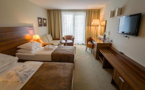 Hotel Trakošćanにあるベッド
