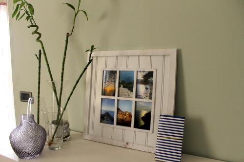 a picture frame sitting on a table in a room at Interno 10 in La Spezia