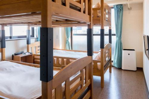 a bunk bed room with two bunk beds at Nice Inn Hotel Ichikawa Tokyo Bay in Urayasu