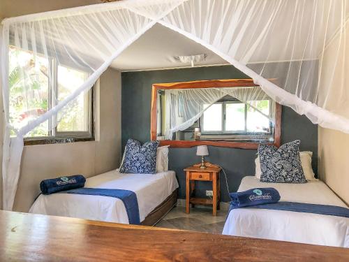 Katil atau katil-katil dalam bilik di Dreamcatcher Lodge