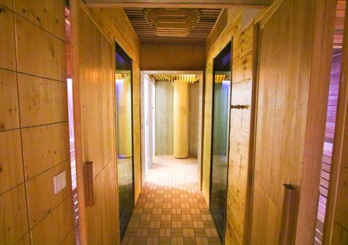 a hallway of a building with wooden walls at Sole Mio Apartment & Wellness in Herceg-Novi
