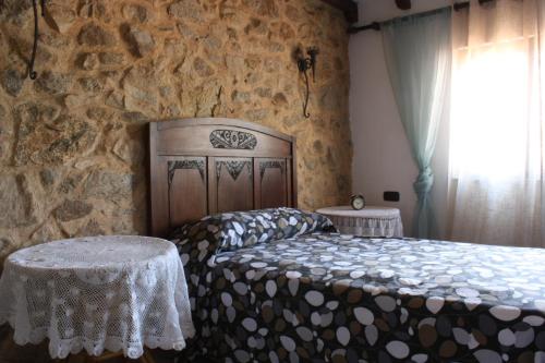 Postel nebo postele na pokoji v ubytování Casa Rural El Palatino