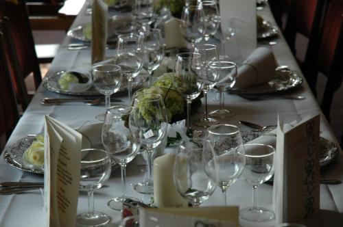 a long table with wine glasses on it at Hotel Kappelner Hof in Kappeln