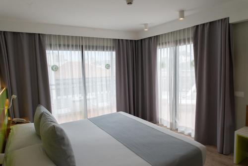 Ένα ή περισσότερα κρεβάτια σε δωμάτιο στο Vanilla Garden Boutique Hotel - Adults Only