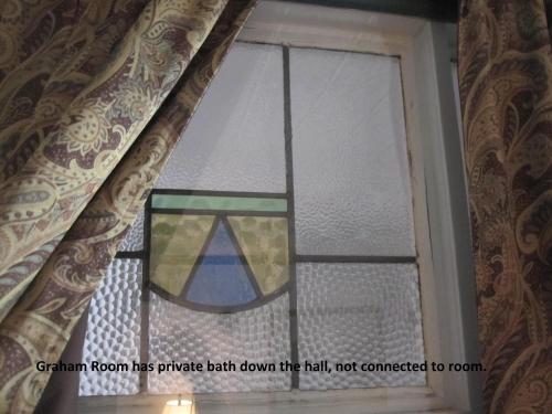 a stained glass window in a room at St. Francis Inn - Saint Augustine in Saint Augustine