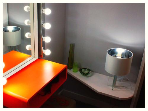 a room with a desk with a mirror and a lamp at The Light Room at no.7 in Hull
