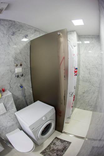 a bathroom with a white toilet and a sink at Apartman Anna Tre Canne Budva in Budva
