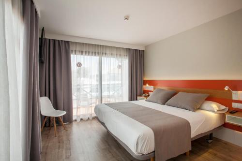 Ένα ή περισσότερα κρεβάτια σε δωμάτιο στο Vanilla Garden Boutique Hotel - Adults Only